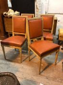 A set of four Louis XVI style side chairs with studded red leather backs and seats (91cm x 47cm x