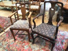 Two early 20thc mahogany armchairs, the larger with dished top above baluster splat, on cabriole