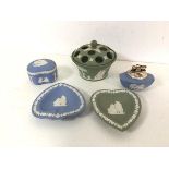 A collection of blue and green Wedgwood jasparware including spade and heart trinket dishes, table