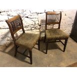 A pair of Regency mahogany chairs, with upholstered seats and reeded front supports united by H