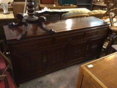 A Chinese cherrywood sideboard with chanelled top fitted three frieze drawers above two cabinets,