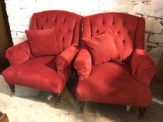 A pair of Edwardian armchairs, in later red polkadot pattern fabric, with button back and scroll