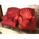 A pair of Edwardian armchairs, in later red polkadot pattern fabric, with button back and scroll