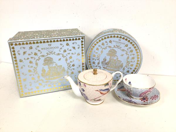 A Wedgwood Cuckoo teapot in original box (10cm x 19cm x 12cm) and a Cuckoo cup and saucer in