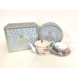 A Wedgwood Cuckoo teapot in original box (10cm x 19cm x 12cm) and a Cuckoo cup and saucer in