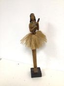 A Hawaiian figure of a Lady playing a Eukele (52cm)