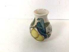 A Moorcroft bud vase depicting Bird on Lemon Branch (10cm)