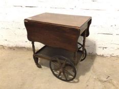 A 1920s/30s drinks trolley with drop leaf sides, hinged handle to one end and drawer to other,