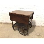 A 1920s/30s drinks trolley with drop leaf sides, hinged handle to one end and drawer to other,