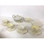 An Edwardian Irish Belleek part teaset, with teapot (11cm x 20cm x 14cm), four teacups, six