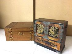 A Japanese parquetry table jewellery cabinet, the two hinged doors, both with lacquered panels