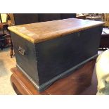 A 19thc blanket box, with painted exterior, the hinged lid above a recess with candle shelf above