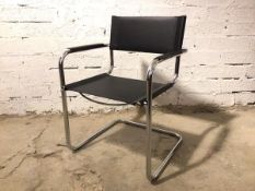 A Bauhaus style cantilever chair with black leather sling back and seat, stamped Made in Italy to