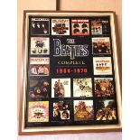 Beatlemania: a poster with Beatle Album covers and their release dates surrounding a 3D The