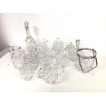 A collection of glassware including preserve jars, decanters, ice bucket with swing handle, wine