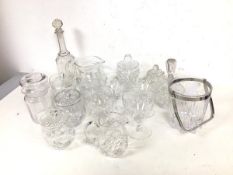 A collection of glassware including preserve jars, decanters, ice bucket with swing handle, wine