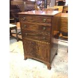 A 19thc side cabinet, the top with moulded edge above three graduated drawers and a pair of panel