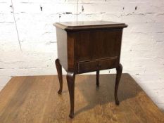 A 1920s/30s mahogany work box, the lift up lid with upholstered interior above a single fitted