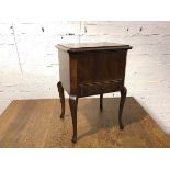 A 1920s/30s mahogany work box, the lift up lid with upholstered interior above a single fitted