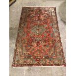 A hamadan rug, with central floral medallion surrounded by foliate design, within a light blue and