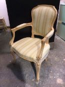A Louis XV style Duresta armchair with striped upholstered armrests and seat (97cm x 61cm x 55cm)