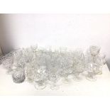A collection of stemware and tumblers, including sherry glasses, port glasses, wine glasses and