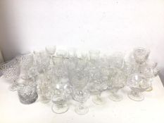 A collection of stemware and tumblers, including sherry glasses, port glasses, wine glasses and