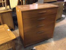 A mid century teak chest of drawers, with four graduated drawers, on castors (85cm x 79cm x 43cm)