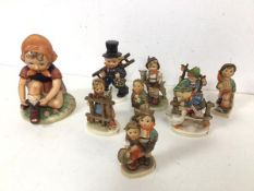 A collection of Hummel figures, some marked W.Goebel (largest: 13cm) and a Hummel style figure of