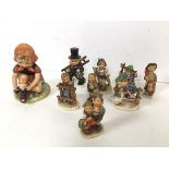 A collection of Hummel figures, some marked W.Goebel (largest: 13cm) and a Hummel style figure of