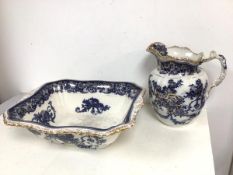 A Victorian wash basin and ewer with blue floral and gilt decoration, base of basin marked Rome with