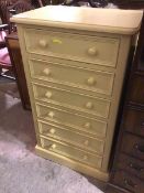 A cream painted pine tall chest of drawers fitted six drawers on plinth base (108cm x 62cm x 40cm)