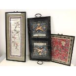 A pair of 1920s Chinese silk panels under glass in ebonised and floral decorated two handled tray (
