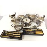 An assortment of Epns including four sauce boats, milk jug (15cm), serving dishes, knives, forks