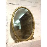 A gilt composition oval wall mirror with bevelled glass within classically inspired frame (59cm x