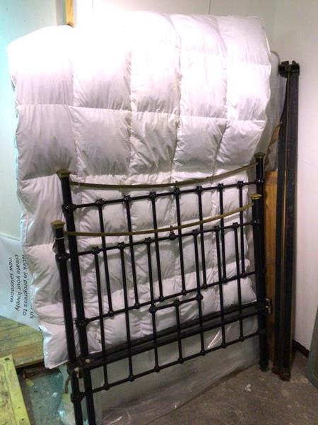 A brass and painted Edwardian metal bed frame, with spindles to head and footboard topped with