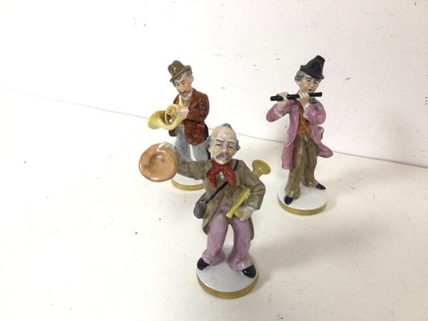 A group of three early 20thc German china figure of Musicians, stamped S under crown with other