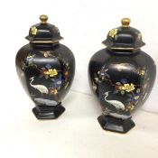 A pair of early 20thc Carltonware footed jars with lids, both decorated with flowers and birds,