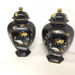 A pair of early 20thc Carltonware footed jars with lids, both decorated with flowers and birds,
