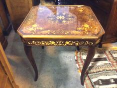 An Italian Sorrento games table, with foliate decorated exterior, includes chequerboard,