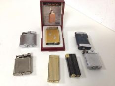 A collection of vintage lighters including two Ronson lighters, two Polo, a Parker and a Japanese