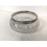 An Edwardian cut glass flower bowl with a Sheffield silver collar (9cm x 23cm)