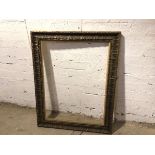 A gilt composition picture frame (103cm x 75cm)