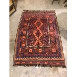 A kelim rug, the central panel with diamonds and geometric design within multiple borders, including
