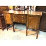 A 1920s/30s mahogany Georgian revival sideboard, with gadrooned edge and bow breakfront above two