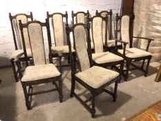 A set of eight Ercol dining chairs with curved upholstered splats above cushion pads on slats, on