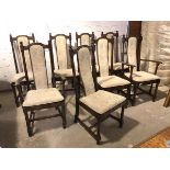 A set of eight Ercol dining chairs with curved upholstered splats above cushion pads on slats, on