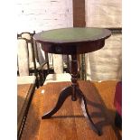 A Georgian style wine table, with circular tooled leather top, fitted single frieze drawer on