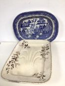 A 19thc ashet with floral decoration, marked Persian to base (49cm x 36cm) and another blue and