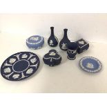 A collection of Wedgwood jasparware including two bud vases (each: 13cm), lidded trinket dishes, a